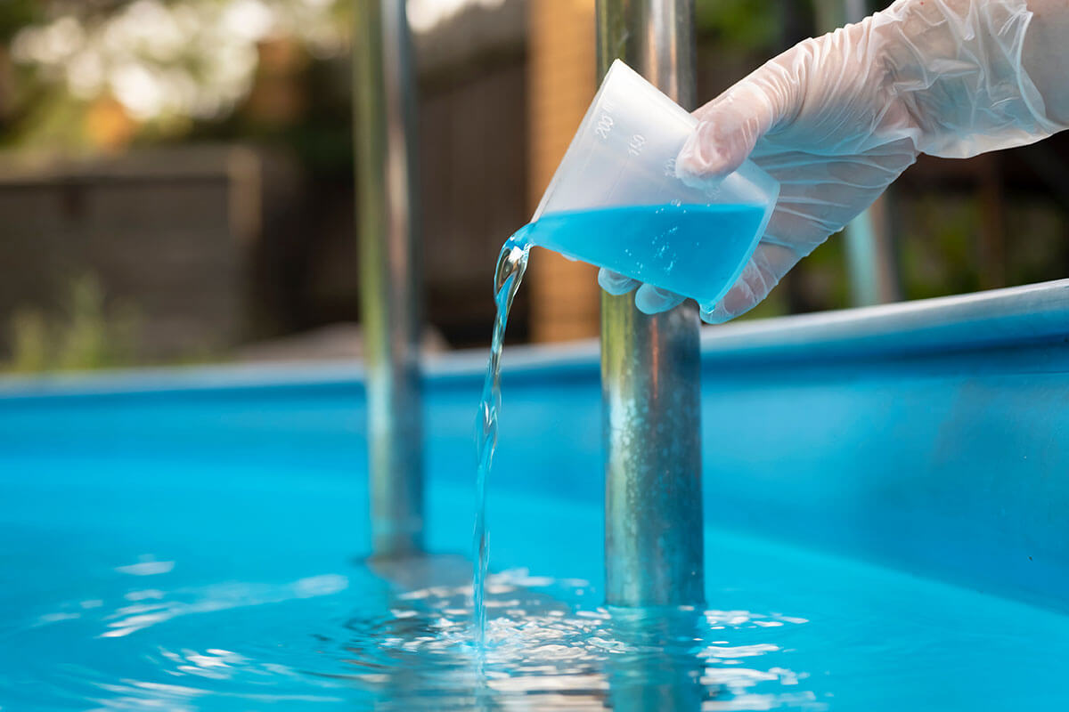 pouring muriatic acid in a pool