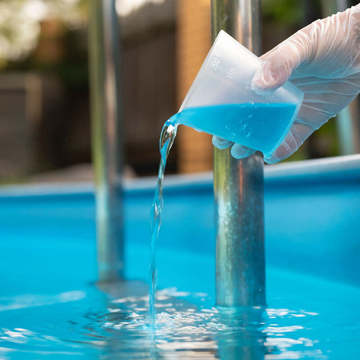 pouring muriatic acid in a pool