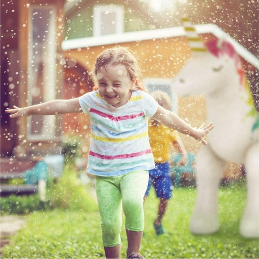 Little girl playing in aHumongous Unicorn Sprinkler