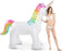 Model standing next to a Swimline Humongous Unicorn Sprinkler