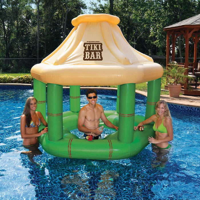 People hanging out in an inflatable floating tiki bar
