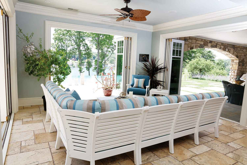back view of White poly lumber outdoor L-shaped sectional sofa set  under a covered patio